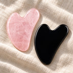 Pink and black gua sha facial massage stone pair