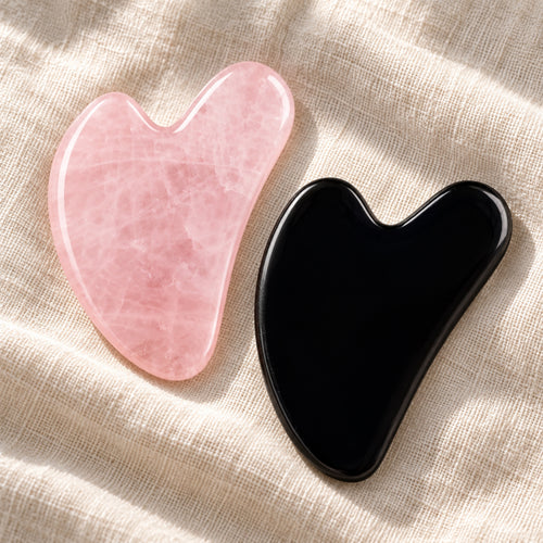 Pink and black gua sha facial massage stone pair