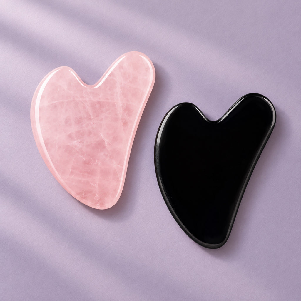 Pink and black gua sha facial massage stone pair