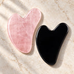 Pink and black gua sha facial massage stone pair