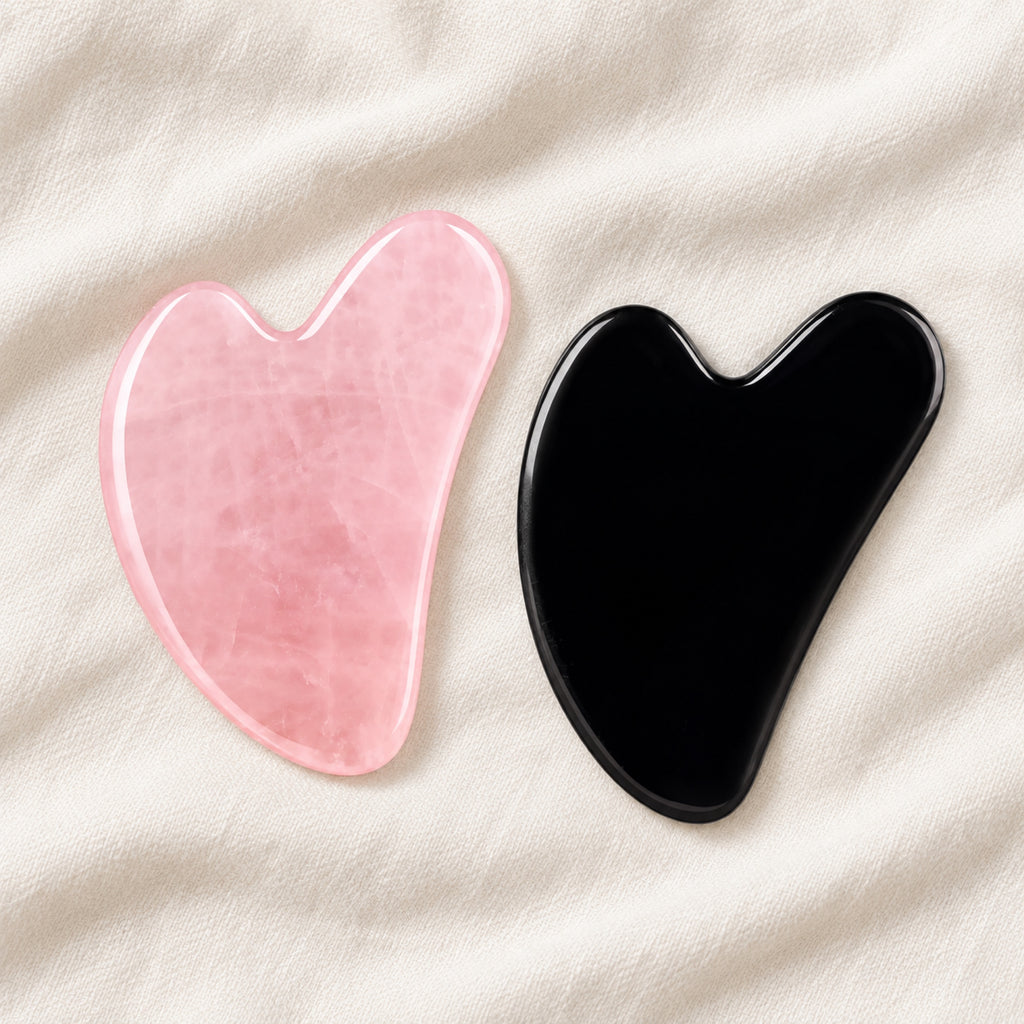 Pink and black gua sha facial massage stone pair